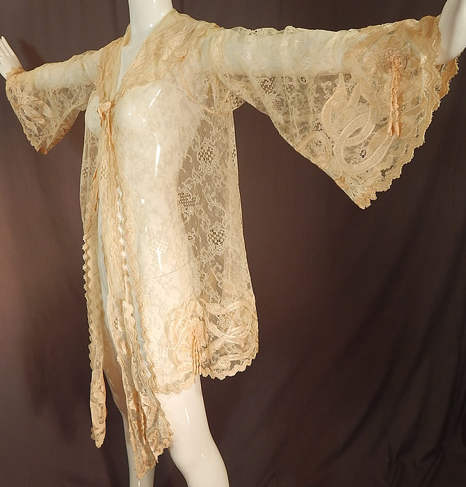 Victorian Blonde Chantilly Lace Cream Silk Applique Trim Bell Sleeve Coat Jacket
The coat measures 32 inches long, with a 40 inch bust, 46 inch waist, and 28 inch long sleeves with 28 inch circumference sleeve cuffs. 