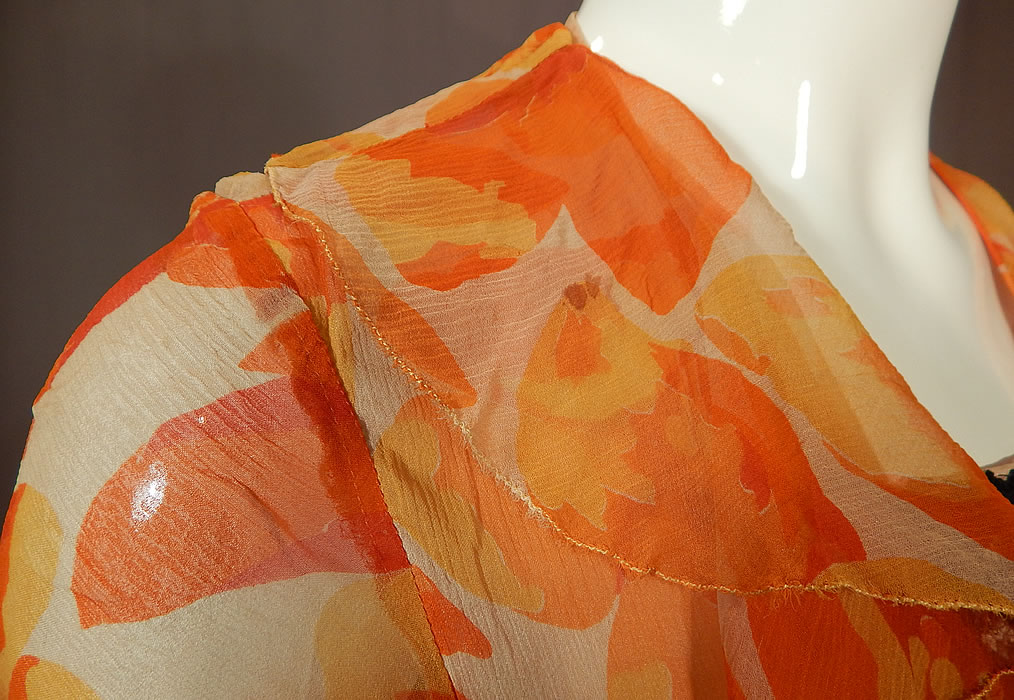 Vintage Floral Orange Blossom Print Silk Chiffon Black Lace Handkerchief Skirt Dress
The dress measures 47 inches long, with a 34 inch bust and 28 inch waist. It is in good condition, with only a small stain on the front collar and a few tiny pin holes on the sleeve. This is truly a wonderful piece of wearable art!