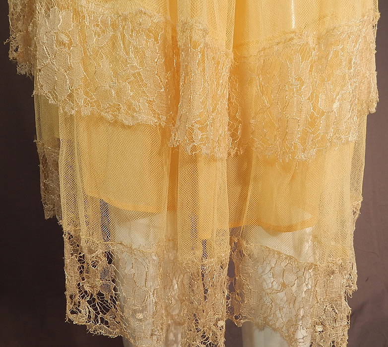 Vintage Art Deco Yellow Silk Cobweb Lace Handkerchief Skirt Flapper Dress
This fabulous flapper dress has a fitted sleeveless top with front gathering, a drop waist, layered tiered uneven handkerchief lace hemline full skirt slightly longer in the back, side snap closures and is sheer, unlined. 