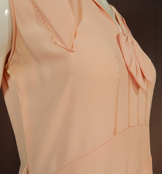 Vintage Pink Pastel Silk Crepe de Chine Drawn Work Cape Sleeve Day Dress
The dress measures 44 inches long, with a 36 inch bust, 32 inch waist and 40 inch hips. It is in good condition, with only some faint discoloration under the arms and inside the back neck. This is truly a wonderful piece of wearable textile art!