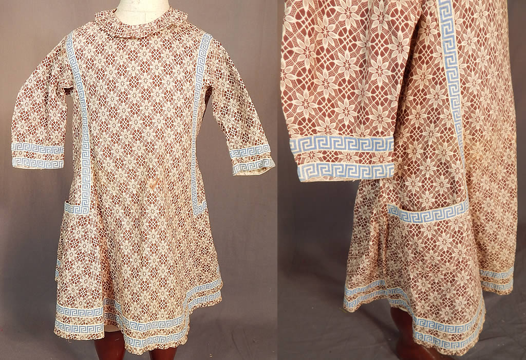 Victorian Childs Cotton Calico Brown Lace Pattern Print Greek Key Trim Dress
This antique Victorian era child's cotton calico brown lace pattern print Greek key trim dress dates from 1890. It is made of a brown and white cotton calico fabric, with a floral lace pattern print design and blue Greek key design ribbon trim edging.