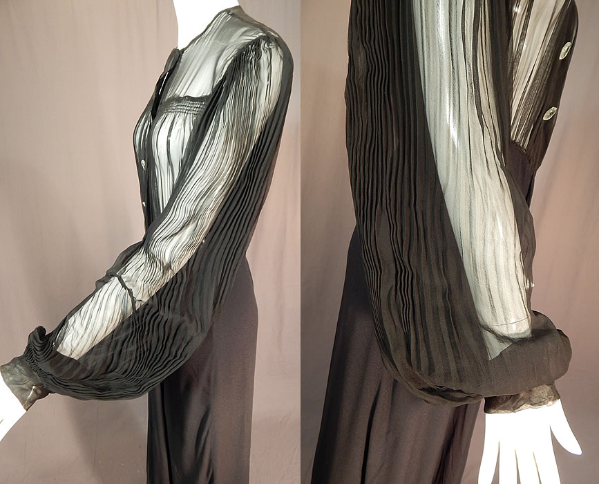 Vintage Black Silk Crepe Sheer Pleated Balloon Sleeve Cocktail Dress Evening Gown
This beautiful black cocktail dress evening gown is a long floor length, with a sheer see through top with smocking details, sheer long pleated full balloon bishop style sleeves with fitted cuffs, decorative cut glass button trim on the front top with hidden snap closures underneath and along the side.