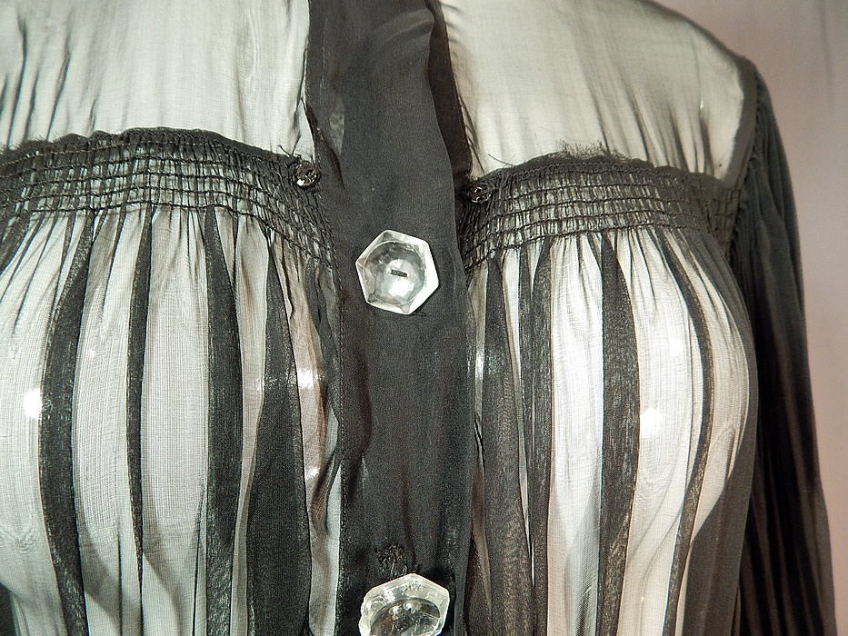 Vintage Black Silk Crepe Sheer Pleated Balloon Sleeve Cocktail Dress Evening Gown
It is in good condition, with only a tiny hole on the back top and a few mystery snaps which I am not sure what originally attached to it, perhaps a shawl collar or cape? This is truly a wonderful piece of wearable art!