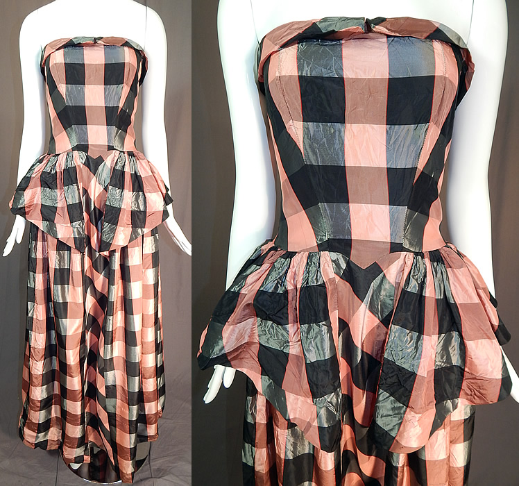Vintage Pink & Black Plaid Check Taffeta Strapless Peplum Maxi Dress Evening Gown
This vintage pink and black plaid check taffeta strapless peplum maxi dress evening gown dates from the 1940s. It is made of a pink and black taffeta fabric with a plaid check checkered pattern design. 