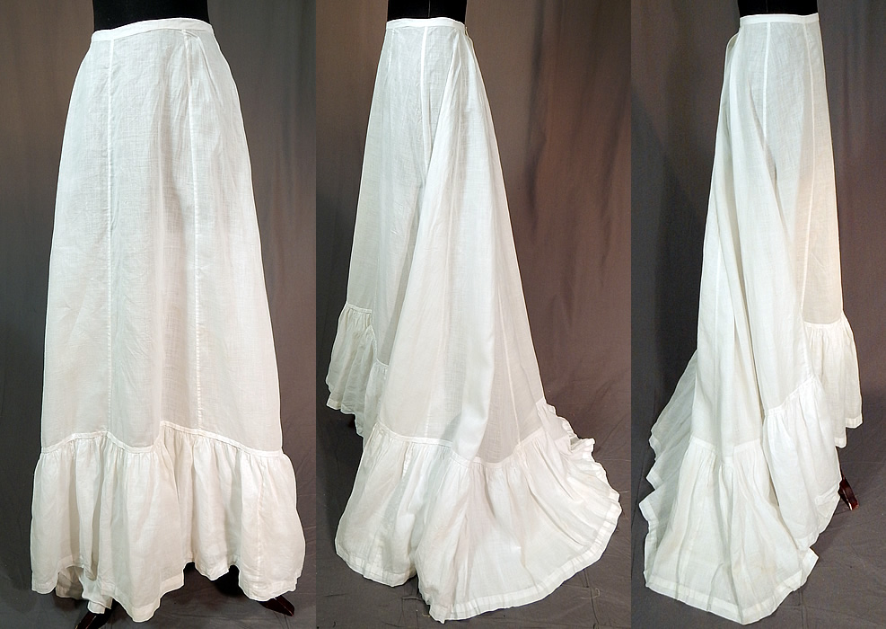 Victorian White Cotton Batiste Ruffle Back Train Wedding Skirt Petticoat
This antique Victorian era white cotton batiste ruffle back train wedding skirt petticoat dates from 1900. It is made of a sheer white cotton batiste silk fabric. 