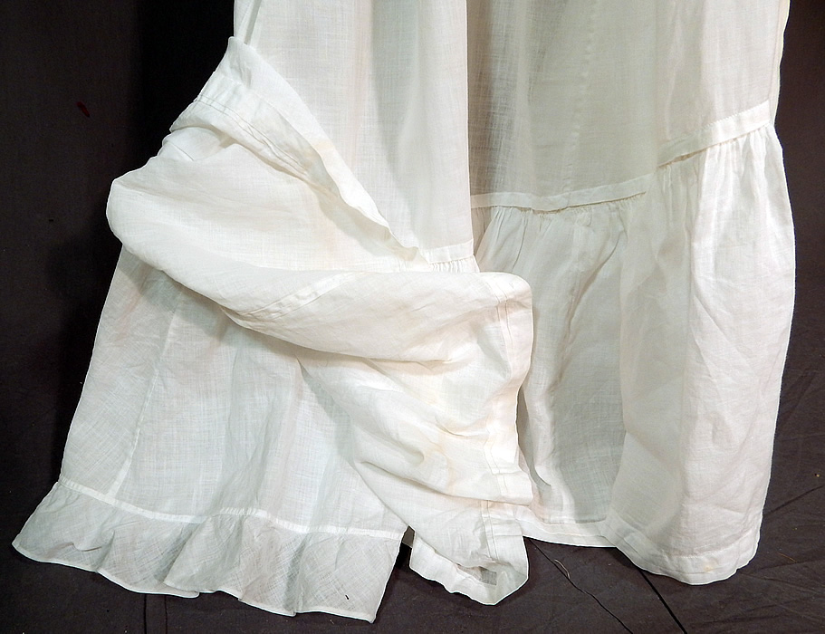 Victorian White Cotton Batiste Ruffle Back Train Wedding Skirt Petticoat
The skirt measures 38 inches long in the front, 48 inches long in the back, with a 21 inch waist. It is in good condition, with only a faint discoloration stain on the bottom front. This is truly a wonderful piece of antique Victoriana bridal wearable art! 