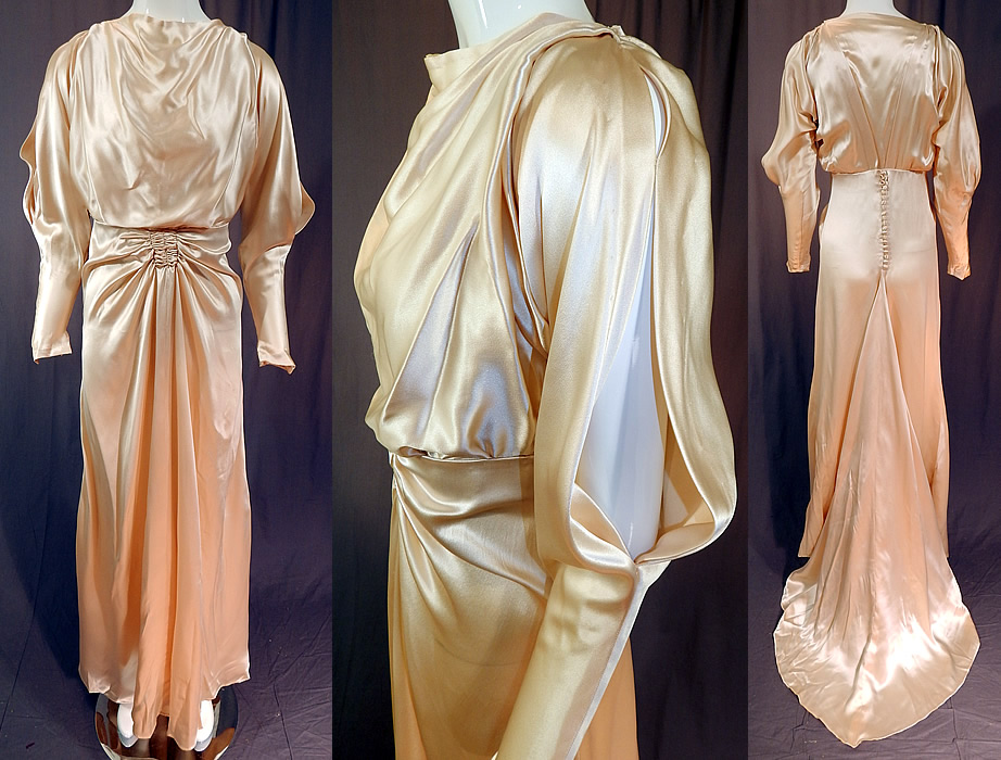 Vintage Cream Silk Charmeuse Cutout Sleeve Bias Cut Wedding Gown Train Dress
This vintage cream silk charmeuse cutout sleeve bias cut wedding gown train dress dates from the 1930s. It is made of an off white cream color lustrous silk charmeuse satin weave luxurious fabric. 