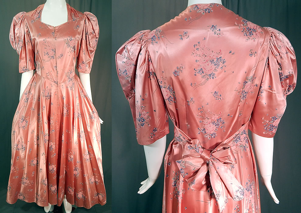 Vintage Pink Pastel Floral Rose Bouquet Print Satin Maxi Dress Gown
This vintage pink pastel floral rose bouquet print satin maxi dress belted gown dates from the 1940s. It is made of a pink satin sheen rayon fabric with a pastel floral rose bouquet print design.