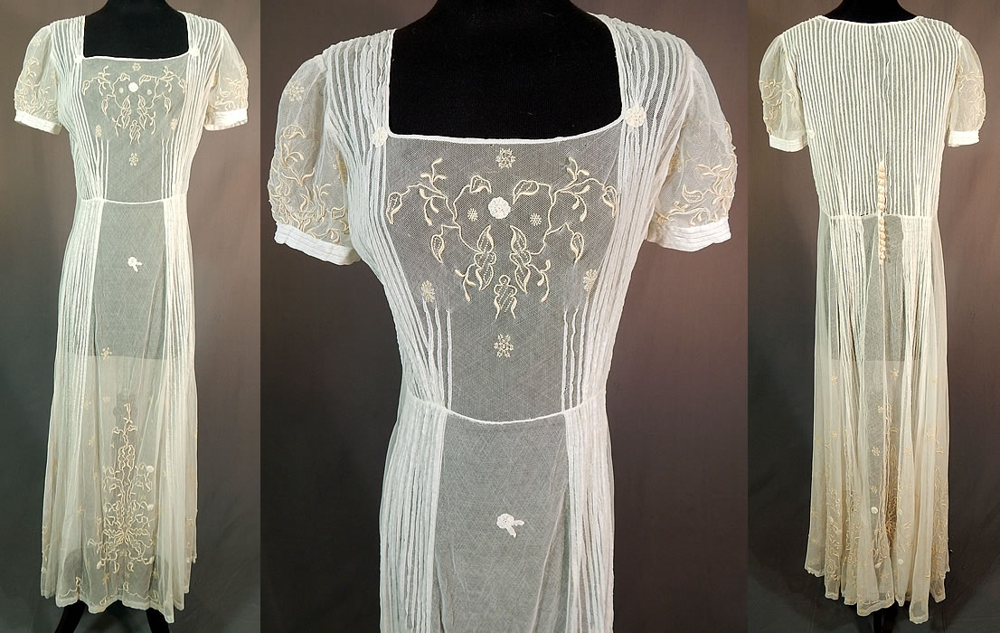 Vintage White Tulle Net Pintuck Pleat Embroidered Lace Applique Maxi Dress
This vintage white tulle net pintuck pleat embroidered lace appliqué maxi dress dates from the 1930s. The dress measures 51 inches long, with a 36 inch bust and 28 inch waist.