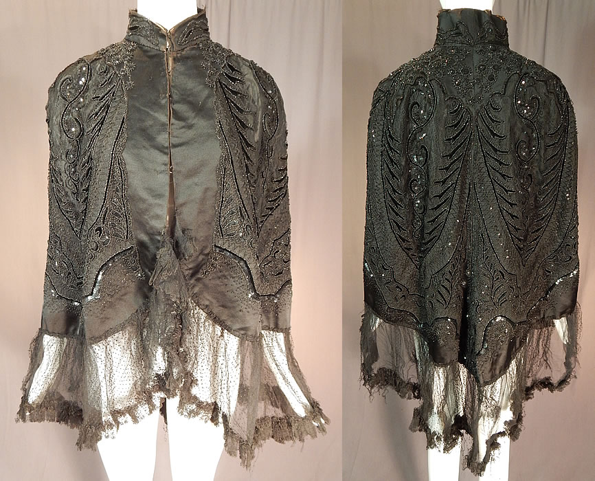 Victorian Hubert & Riqueur Paris Label Black Silk Lace Jet Beaded Mantle Cloak Cape
This antique Victorian era Hubert & Riqueur Paris label black silk, lace, jet mantle cloak cape dates from 1890.