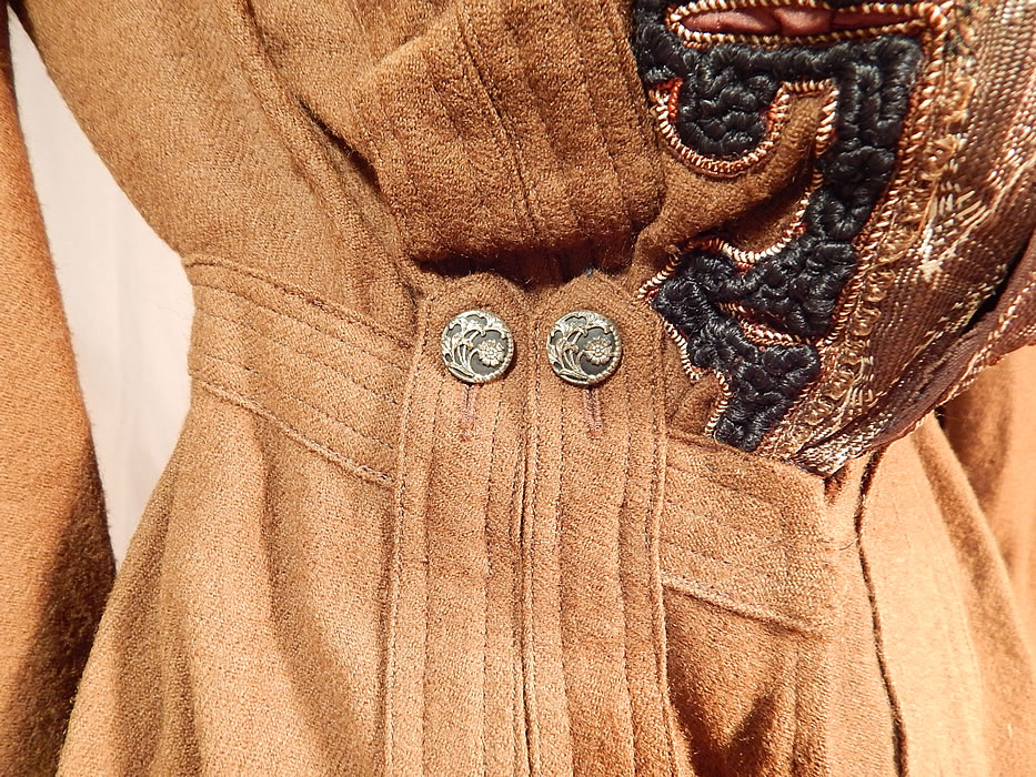 Victorian Brown Wool Soutache Button Trim Walking Suit Jacket Winter Coat
This wonderful winter walking suit coat jacket has a tailored, fitted long mid length, pouter pigeon style with stitched fabric appliqué strip trim accents, decorative steel cut floral button trimmings on the back waist and front, gathered shoulders with long full sleeves, gauntlet cuffs, hook closures on the front and is lined in the top only with a brown polished cotton fabric inside.