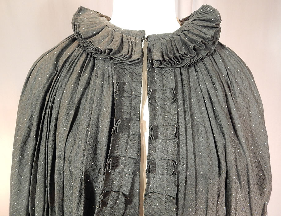 Victorian Black & White Polka Dot Cotton Calico Ruff Collar Winter Cloak Cape
This wonderful womens winter cloak cape is a long length, with a box pleat ruff collar, hook closure at the neck, box pleated trim edging down the front opening with inner fabric straps, layered ruffle bottom and is fully lined in a soft flannel cotton brown striped ticking fabric lining inside. 