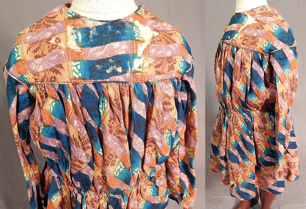 Victorian Civil War Era Childs Floral Patchwork Plaid Print Wool Button Back Dress
This charming child's dress could have been worn by either a boy or girl. It has a gathered waist, short full skirt with layered stitching, long sleeves, decorative black silk covered buttons down the back with hidden hook closures underneath and only the top yoke is lined.