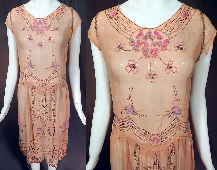 Vintage Art Deco Pink Silk Chiffon Lavender Floral Leaf Beaded Flapper Dress
This vintage Art Deco pink silk chiffon lavender floral leaf beaded flapper dress dates from the 1920s. It is made of a pink pastel sheer silk chiffon fabric with pink, purple lavender and silver beading done in a pansy flower, floral garland, wreath design and an oak leaf outline strategically placed on the front and back skirt.