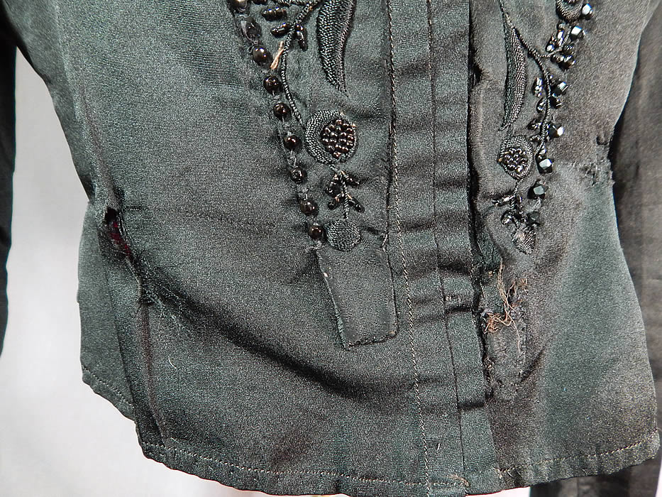 Victorian Black Silk Embroidered Jet Beaded Bodice Coat Jacket
It is in fair as-is condition, with some frayed, mended repairs on the bottom front and some fraying along one shoulder (see close-ups). 