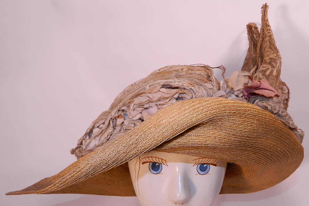 Edwardian Woven Natural Straw Tambour Net Lace Wired Wing Floral Wide Brim Hat. This antique Edwardian era woven natural straw tambour net lace wired wing floral wide brim hat dates from 1910.