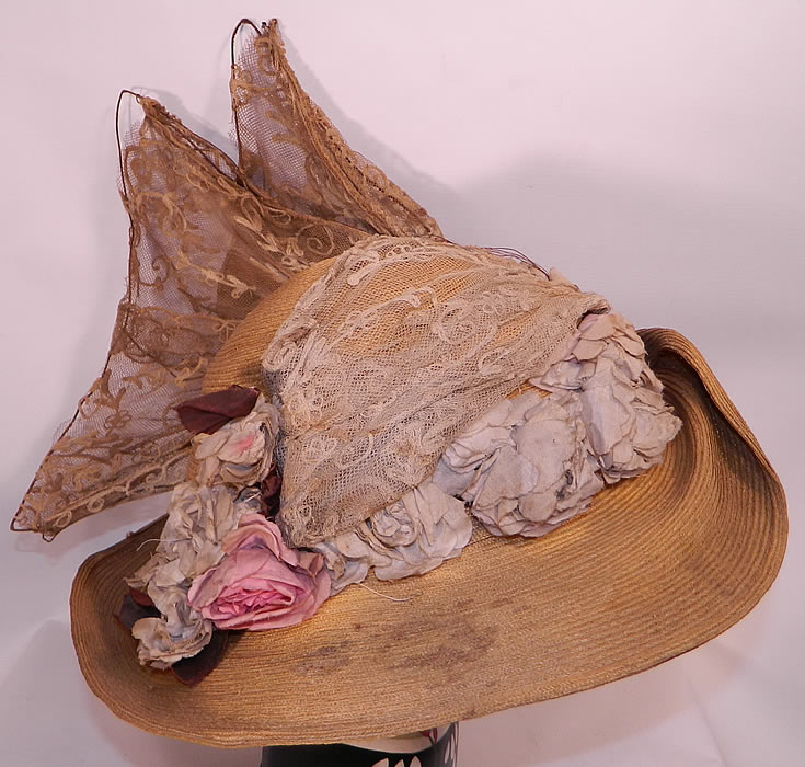 Edwardian Woven Natural Straw Tambour Net Lace Wired Wing Floral Wide Brim Hat. There are pale pink and lilac silk flowers trim. 