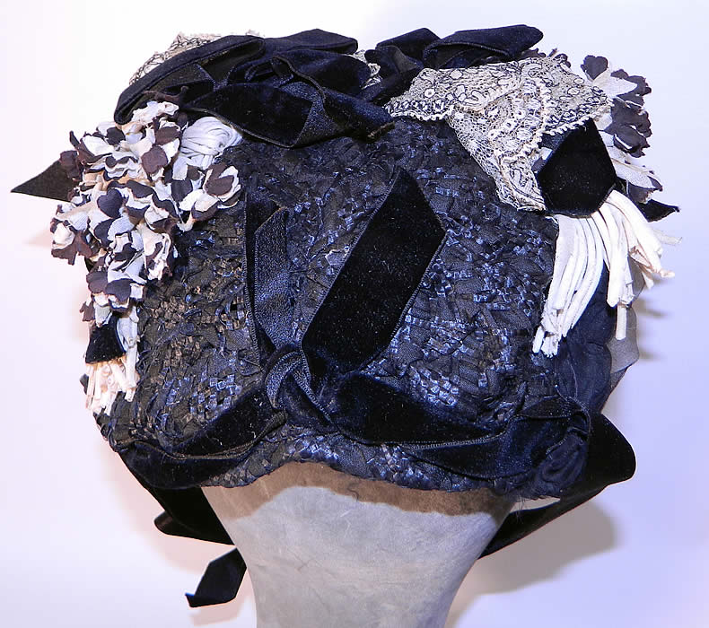 Victorian Black & White Violet Flower Lace Trim Straw Bonnet Hat. The bonnet measures 25 inches in circumference and 8 inches across. It is in good condition. This is truly a wonderful piece of wearable millinery art!