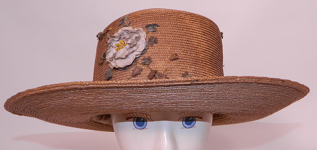 Edwardian Belle Epoque Natural Straw White Floral Wide Brim Boater Summer Hat. This Edwardian era Belle Epoque natural straw white floral wide brim boater summer hat dates from 1910.