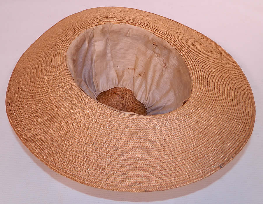 Edwardian Belle Epoque Natural Straw White Floral Wide Brim Boater Summer Hat. It is in good condition, with only some dust on the straw and faint stains on the inside lining. 