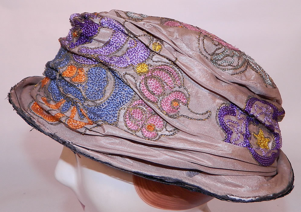 Vintage Art Deco Taupe Silk Colorful Crewel Chain Stitch Flapper Cloche Hat. This vintage Art Deco taupe silk colorful crewel chain stitch flapper cloche hat dates from the roaring 1920s.
