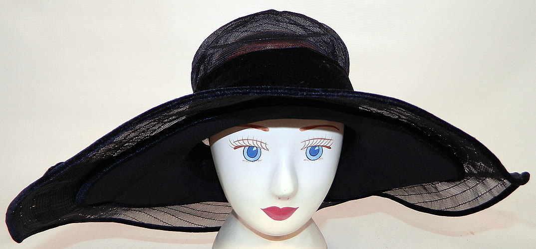 Vintage Gilman Importers Ritz Carlton New York Black Horse Hair Straw Wide Brim Cloche Hat. The hat is made of a sheer woven black horse hair straw, with a black silk chiffon wired smaller brim lining underneath.