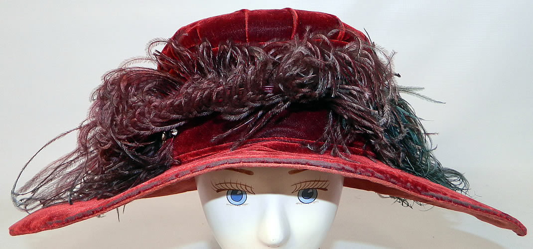 Vintage Fall Color Burgundy Red Velvet Feather Boa Trim Wide Brim Cloche Hat. This vintage fall color burgundy red velvet feather boa trim wide brim cloche hat dates from the 1920s.