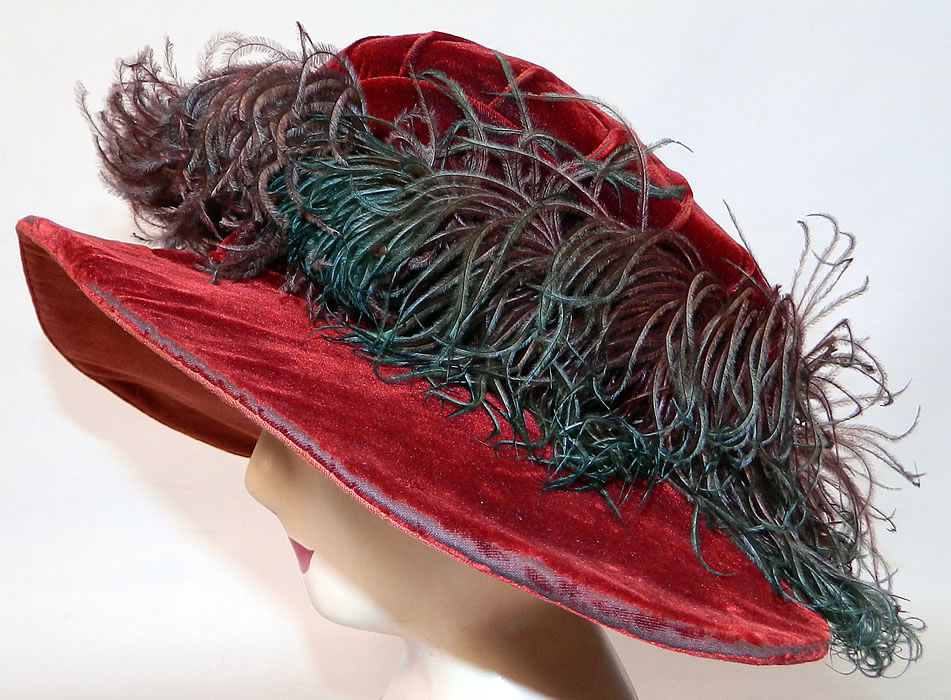 Vintage Fall Color Burgundy Red Velvet Feather Boa Trim Wide Brim Cloche Hat. The hat measures 23 inches inside crown circumference and 44 inches outside.