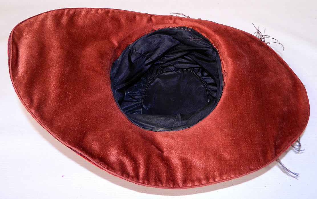 Vintage Fall Color Burgundy Red Velvet Feather Boa Trim Wide Brim Cloche Hat.  It is fully lined inside with black silk fabric. This is truly a wonderful piece of quality made wearable textile millinery art!