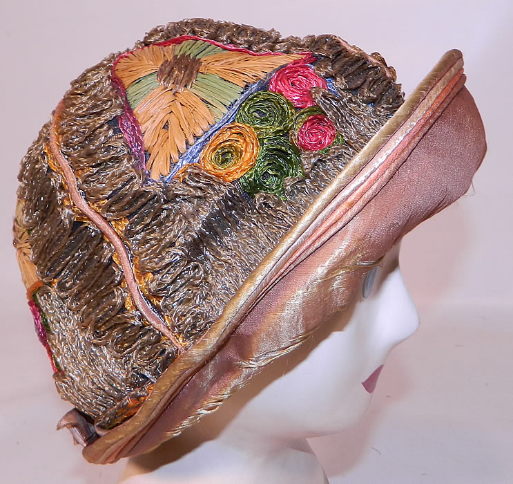 Vintage Colorful Straw Raffia Ribbon Work Embroidered Flapper Cloche Hat. This vintage colorful straw raffia ribbon work embroidered flapper cloche hat dates from the 1920s.