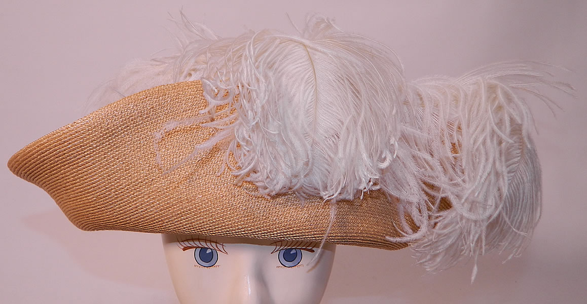 Edwardian Titanic Natural Straw Upturned Wide Brim White Ostrich Feather Hat. This antique Titanic Edwardian era natural straw upturned wide brim white ostrich feather hat dates from 1912.
