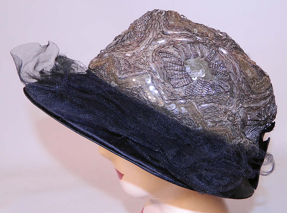 Vintage Emmaline Silver Lame Lam&eacute; Embroidered Sequin Trim Black Silk Wide Brim Cloche Hat. This fabulous flapper cloche style hat has a wide brim front and no brim on back. 