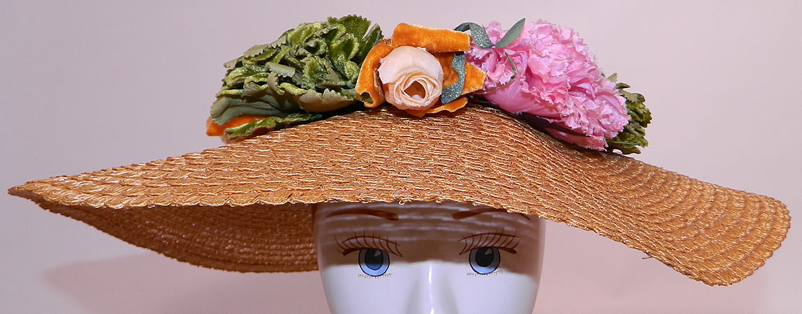 Vintage Woven Natural Straw Silk Velvet Flowers Wide Brim Summer Cartwheel Hat. It is made of a tightly woven natural straw, with a colorful floral hatband made of a variety of silk, velvet flowers encircling the crown.