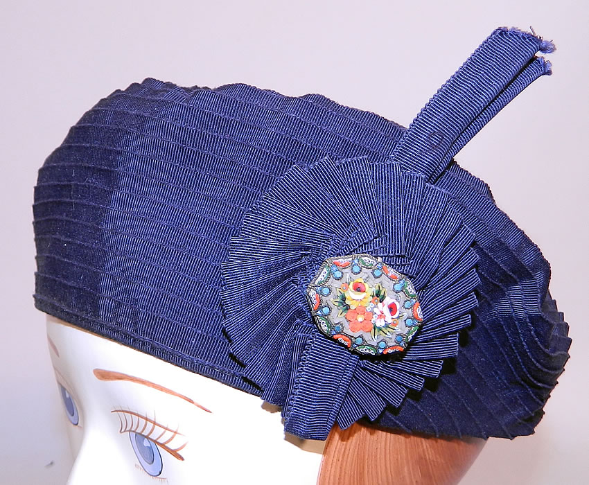 Vintage Eva Mae Navy Blue Pleated Beret Tam Hat & Italian Micro Mosaic Brooch Pin. This vintage Eva Mae navy blue pleated beret tam hat and Italian micro mosaic brooch pin dates from the 1940s.