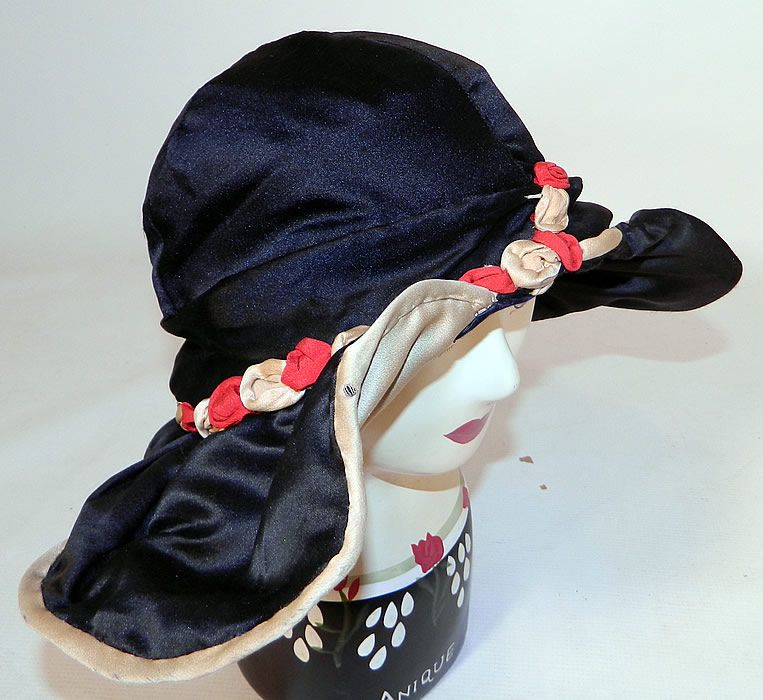 Vintage Art Deco Black & White Silk Red Rosette Wired Wing Brim Flapper Cloche Hat. This fabulous flapper cloche style hat has a unique wired wing wide brim fanning out on either side creating a contrasting color oval shape.