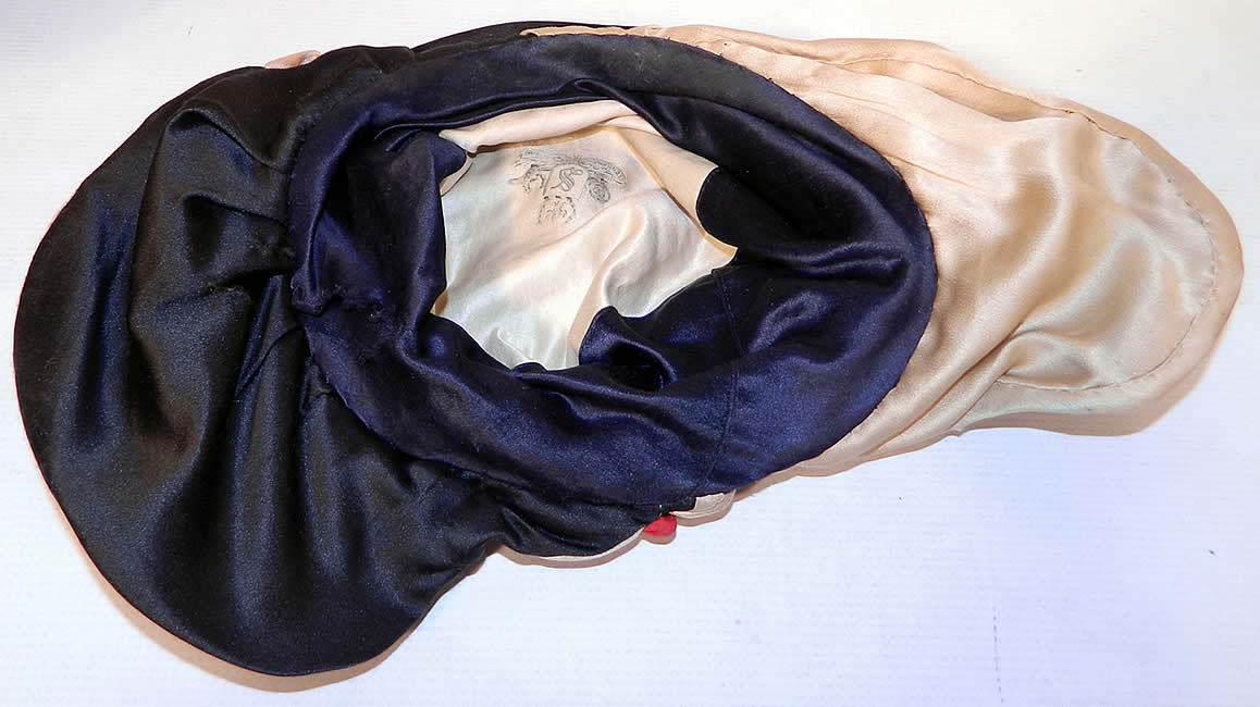 Vintage Art Deco Black & White Silk Red Rosette Wired Wing Brim Flapper Cloche Hat. This is truly a rare and wonderful piece of wearable Art Deco millinery art! 