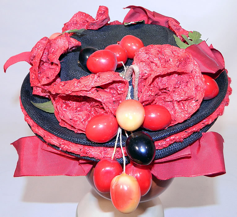 Vintage Red Straw Roses Cherries Small Skimmer Boater Tilt Hat Fascinator. The hat measures 21 inches in circumference inside the crown. 