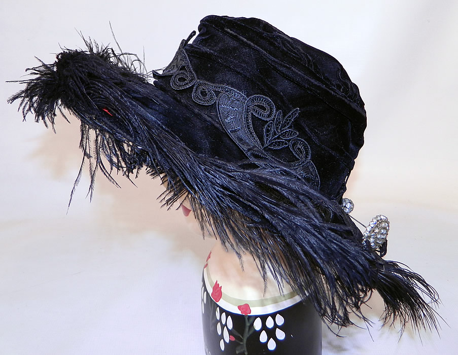 Edwardian Vintage Madame Gatecliff Modiste Black Velvet Lace Feather Trim Wide Brim Hat. This Edwardian era vintage Madame Gatecliff Modiste black velvet lace feather trim wide brim hat dates from 1918.
