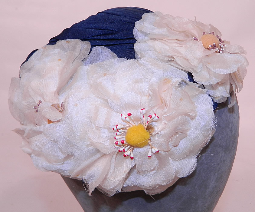 Vintage Rosa et Valentine Paris Label Blue Silk White Magnolia Flower Fascinator Hat.
This unique open crown fitted fascinator style cocktail hat sits atop the head. 