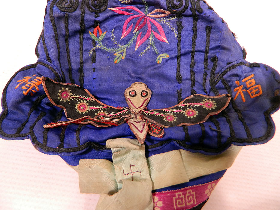 Antique Chinese Child Infant Silk Embroidered Butterfly Wind Hat Cap
These Han Chinese children's and infant hats were designed to provide protection from evil spirits, demons, and ghosts, but also to influence the wearer with important qualities such as wealth, health, courage, academic success, happiness, long life, grace and beauty. 