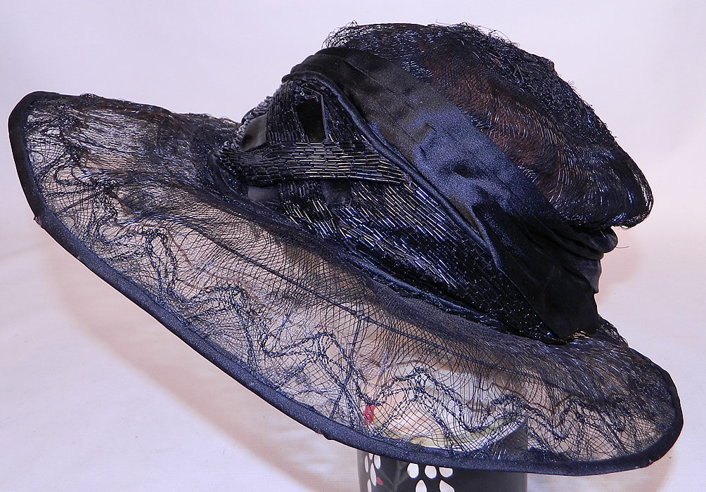 Vintage Burke Beaded Black Woven Horse Hair Straw Sheer Wide Brim Cloche Hat
There is black jet beaded trim done in an Art Deco geometric design on the front hatband. 