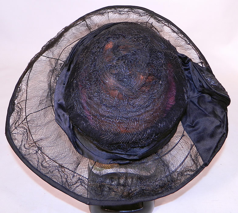 Vintage Burke Beaded Black Woven Horse Hair Straw Sheer Wide Brim Cloche Hat
This fabulous flapper cloche style hat has a wide brim which has an uneven asymmetrical oval shape, wider along the sides and is sheer, completely unlined. 