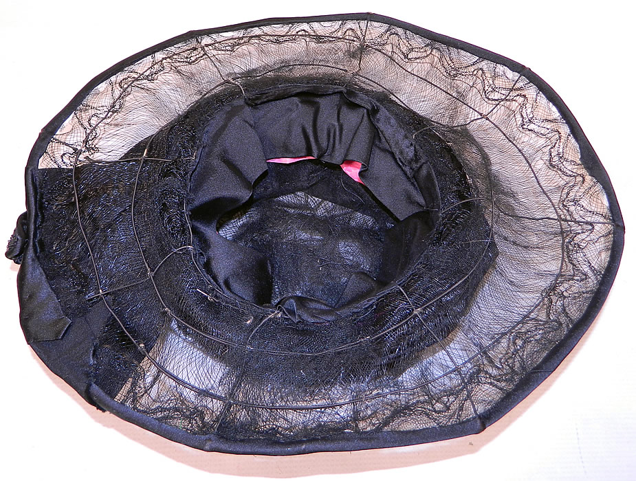 Vintage Burke Beaded Black Woven Horse Hair Straw Sheer Wide Brim Cloche Hat
The hat measures 22 inches inside crown circumference and 50 inches outer brim. It is in good condition, with only a few small breaks in the net. This is truly a wonderful piece of wearable Art Deco millinery art! 