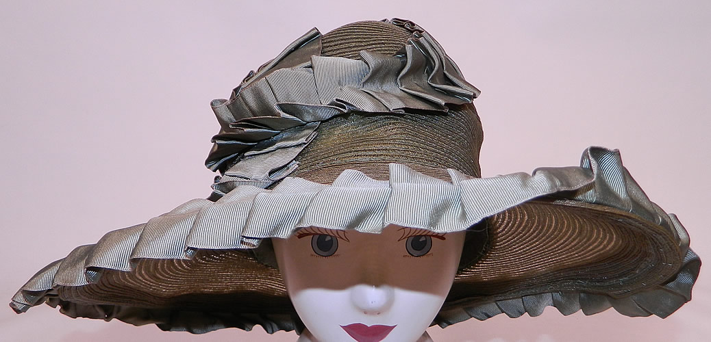 Vintage Sage Green Straw Silk Ribbon Ruffle Trim Wide Brim Cloche Hat
This vintage sage green straw silk ribbon ruffle trim wide brim cloche hat dates from the 1920s.
This is truly a wonderful piece of wearable Art Deco millinery art!