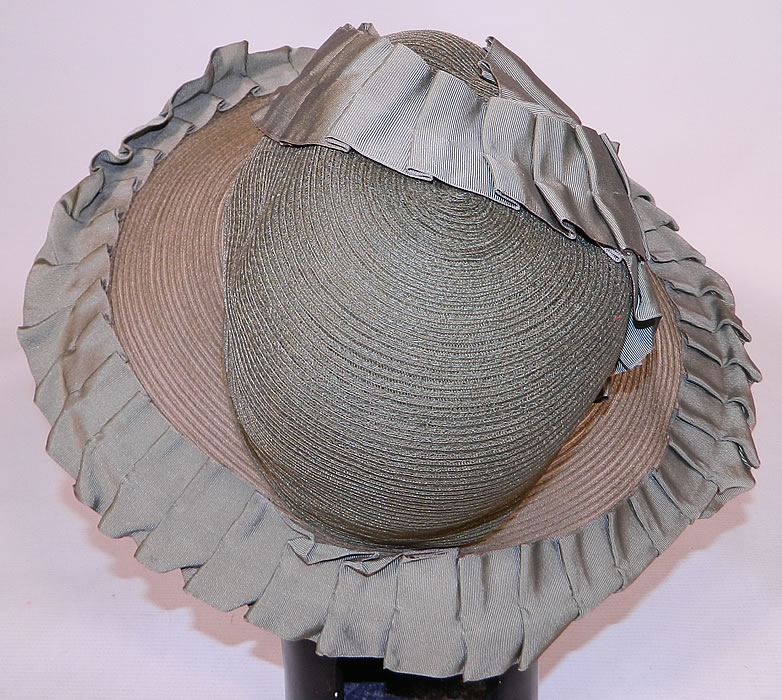 Vintage Sage Green Straw Silk Ribbon Ruffle Trim Wide Brim Cloche Hat
It is fully lined in a sage green silk fabric inside. The hat measures 22 inches inside crown circumference and 41 inches outside. 