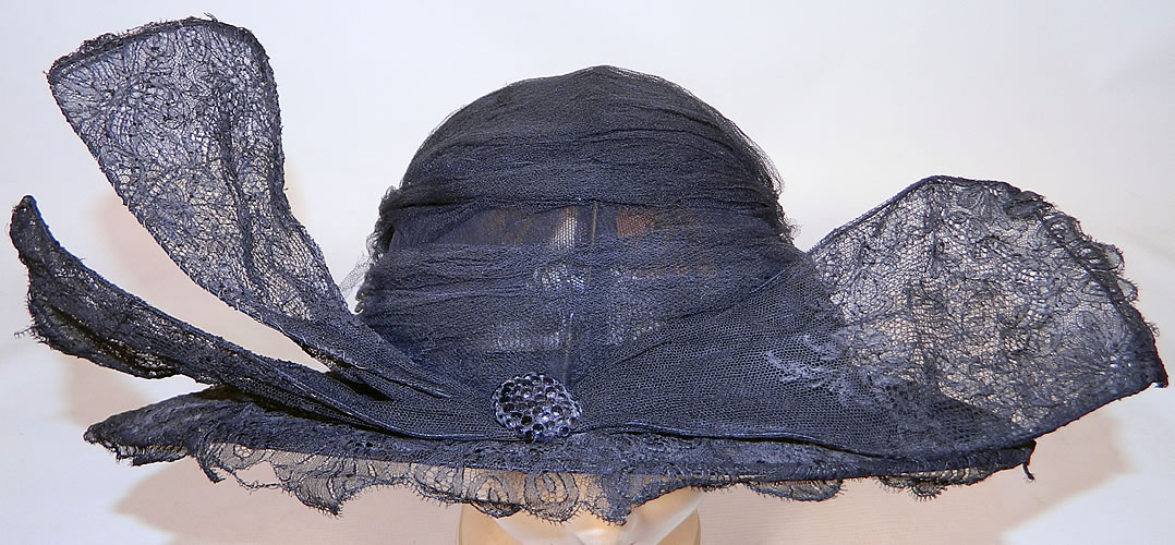 Vintage Black Chantilly Lace Wired Wing Trim Wide Brim Cloche Hat
This vintage black chantilly lace wired wing trim wide brim cloche hat dates from the 1920s.