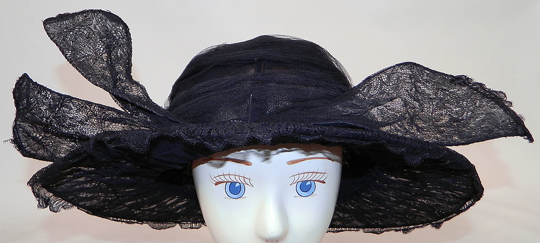 Vintage Black Chantilly Lace Wired Wing Trim Wide Brim Cloche Hat
It is made of a wired frame covered with a sheer black net fabric and fine black chantilly lace.