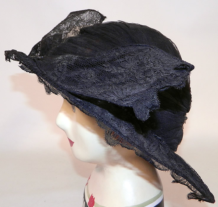 Vintage Black Chantilly Lace Wired Wing Trim Wide Brim Cloche Hat
There is a wired wing bow trim covered with chantilly lace and a jet beaded button hatband accent. 