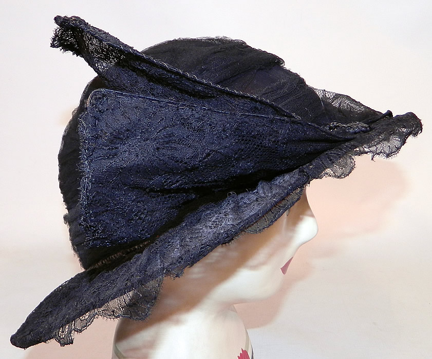 Vintage Black Chantilly Lace Wired Wing Trim Wide Brim Cloche Hat
This fabulous flapper cloche style hat has a form fitting style with an uneven asymmetrical oval shape brim, which is wider along the sides. 