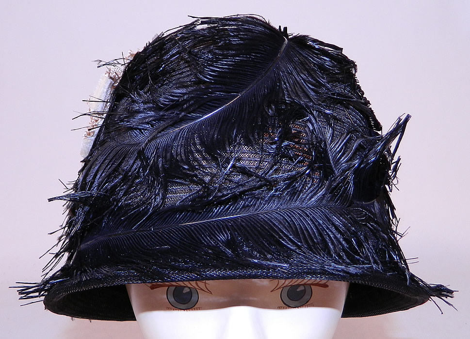 Vintage Black Feather Woven Horse Hair Straw Flapper Cloche Hat
The hat is made of a sheer woven black horse hair net straw covered with black feathers and a small cream velvet ribbon bow trim on the side.